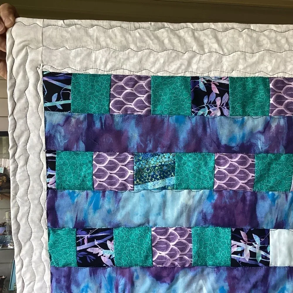 NWT. Hand Crafted Patchwork Quilt with Blues, Purples and Teals Accents